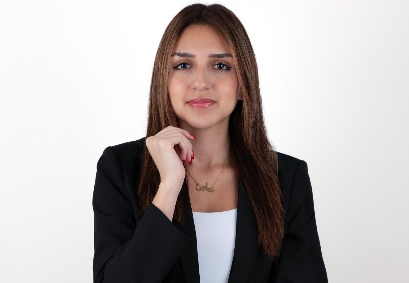 Headshot Studio Portraits Miami Young woman in a red blazer, posing at Headshot Studio Portraits.